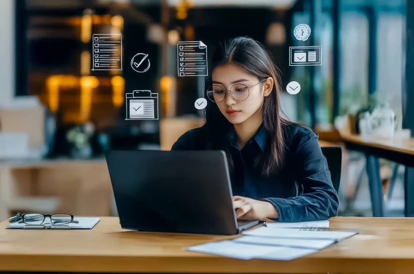 International students seeking a loan working at a laptop