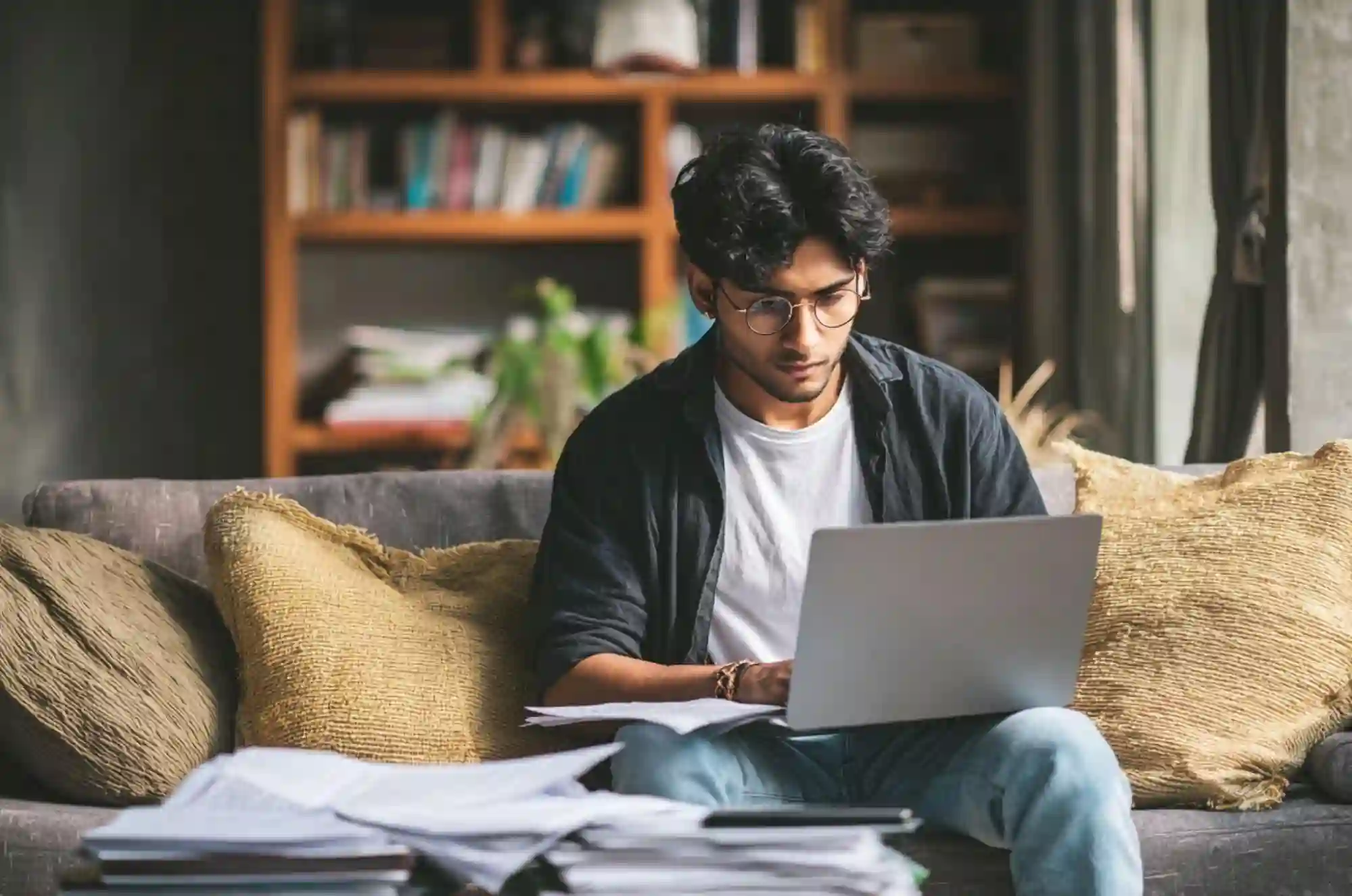 A Nepali student working in a dorm while studying abroad