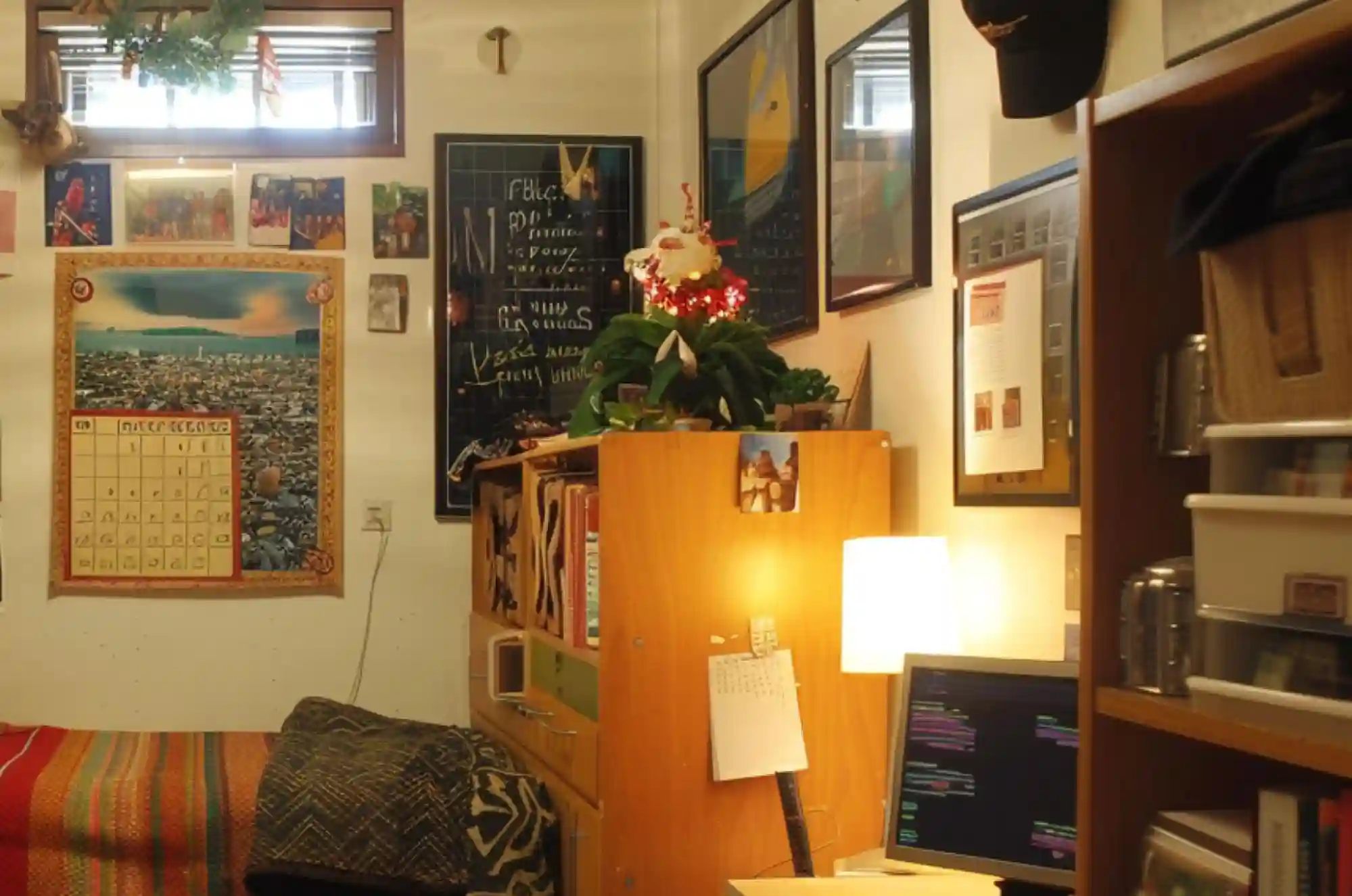 A small dorm room shows signs of comfort and familiarity, with a photo wall of family, souvenirs from home and a calendar marked with both local events and cultural holidays.