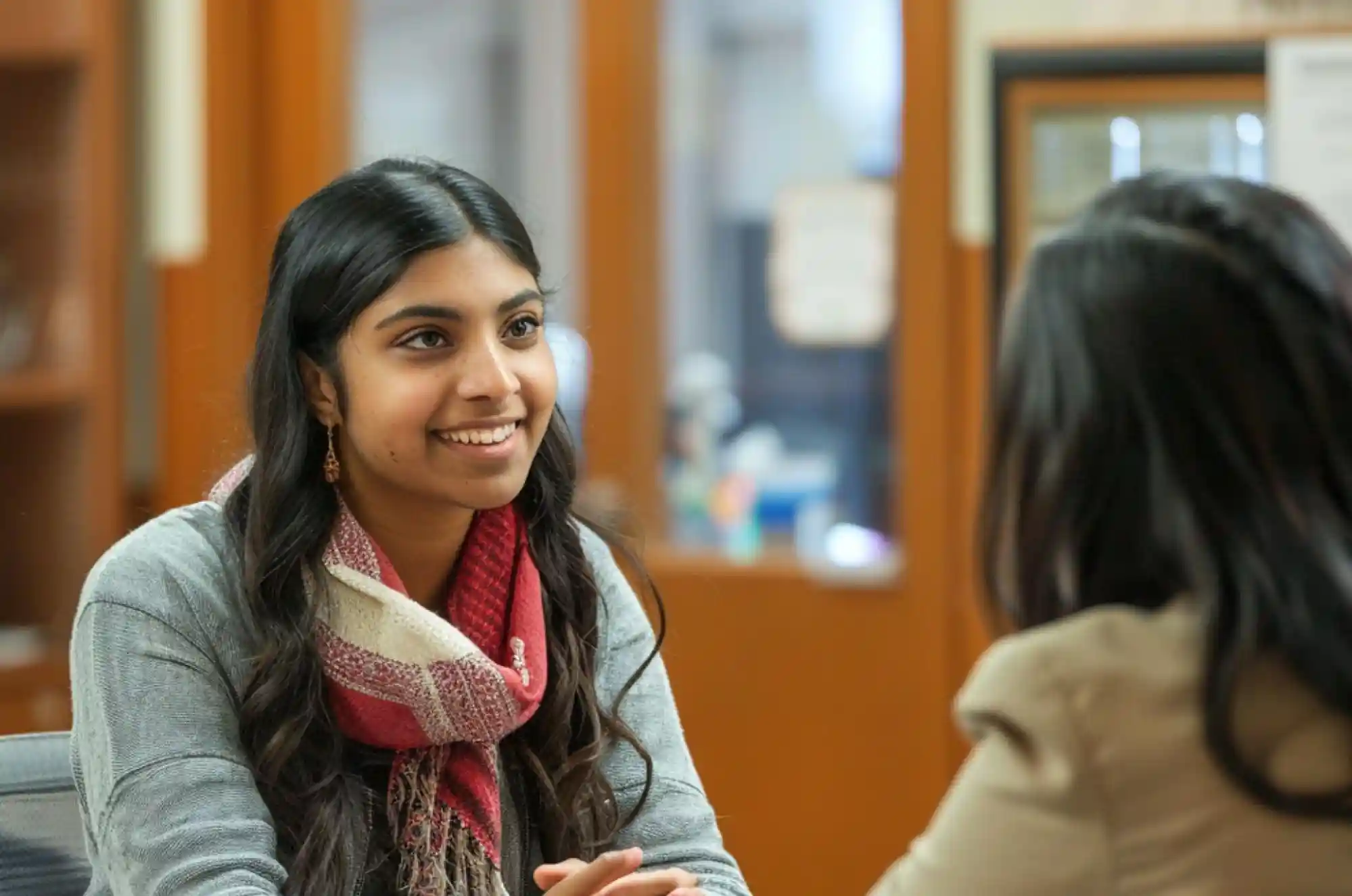 Indian graduate student  at a university career fair