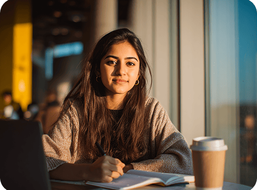 freelancer_digital_Pakistani_student_studying_in_a_modern_caf_e8c4ee69-07d8-4af9-a5fe-cdaf87a1b6c4_0 1