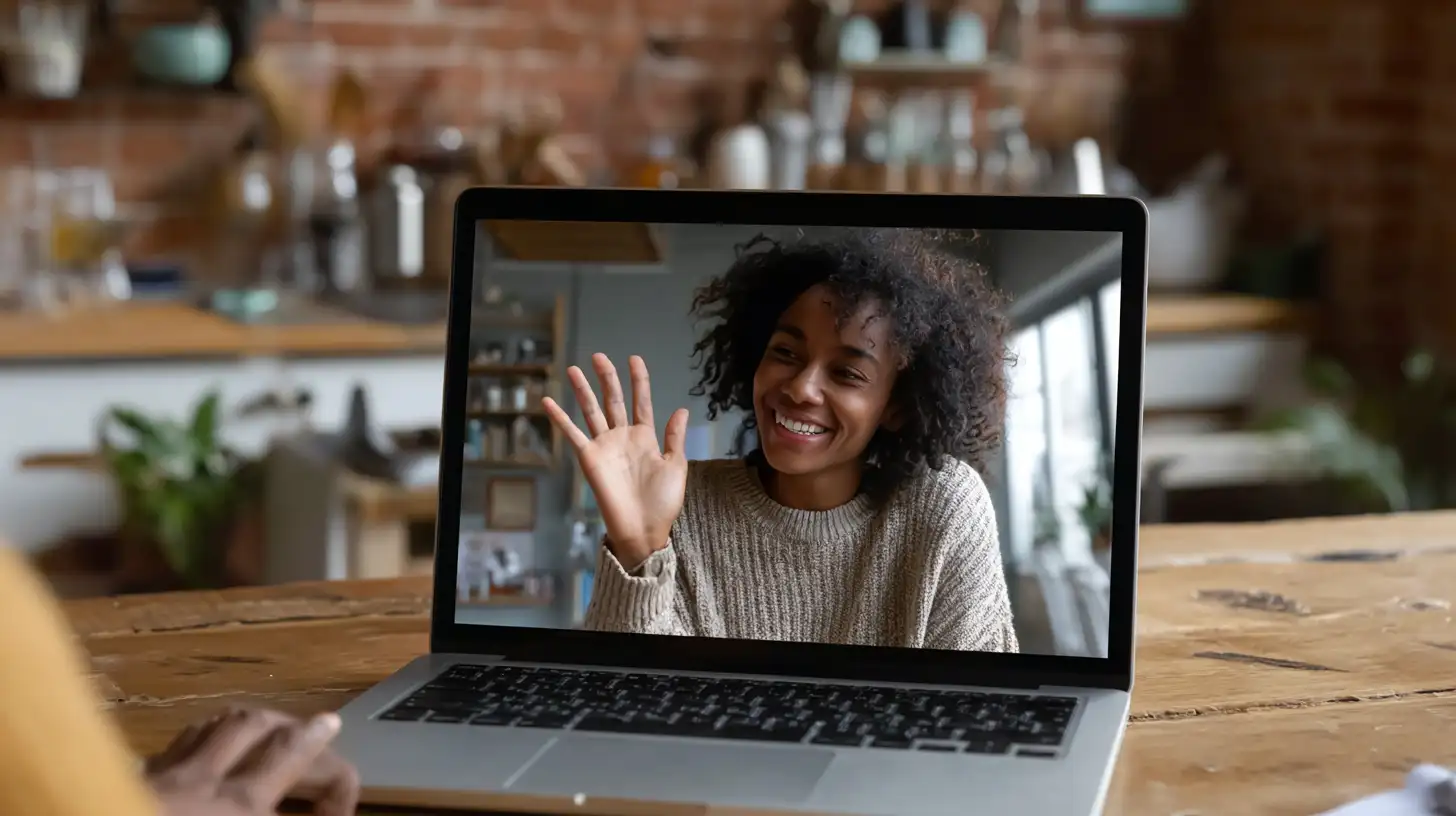 Insert Image alt text hereInternational student on a video call with family, smiling and celebrating after securing a graduate loan to cover tuition and housing expenses