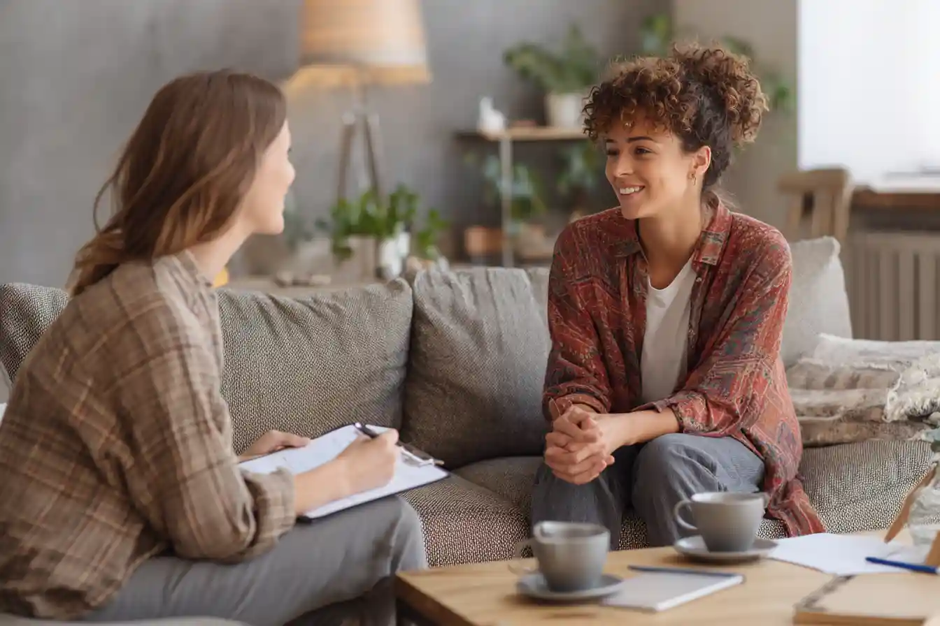 Student practices F-1 visa interview questions at home with a family member.